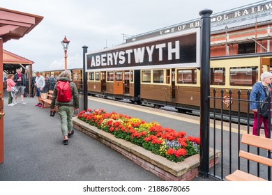 ABERYSTWYTH, WALES, UK - JULY 06, 2022: The Vale of Rheidol Railway steam engine train is waiting on the platform to take tourists on a 12 miles  scenic journey from Aberystwyth to Devil's Bridge