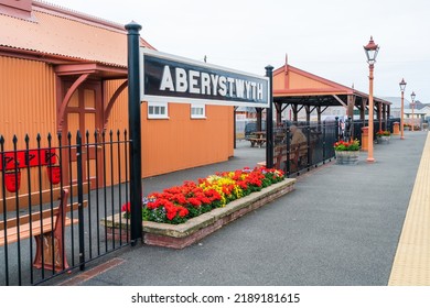 ABERYSTWYTH, WALES, UK - JULY 06, 2022: Aberystwyth train station sign on the platform
