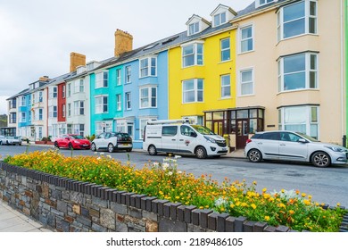 ABERYSTWYTH, WALES, UK - JULY 06, 2022: A row of colorful houses in Aberystwyth, a university town and community in the historic county of Cardiganshire in Wales