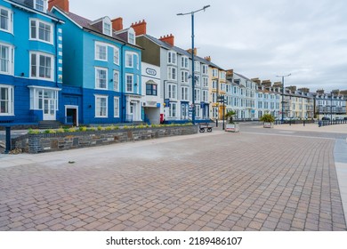 ABERYSTWYTH, WALES, UK - JULY 06, 2022: View of seafront Promenade and Victorian housing and hotels in Aberystwyth, a university town and community in the historic county of Cardiganshire in Wales