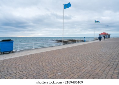 ABERYSTWYTH, WALES, UK - JULY 06, 2022: View of seafront Promenade in Aberystwyth, a university town and community in the historic county of Cardiganshire in Wales