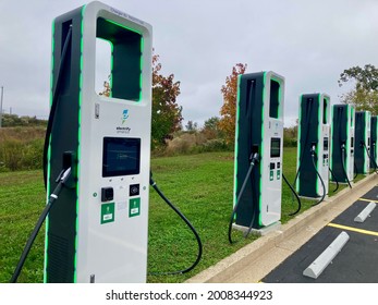 Abingdon, Maryland, USA - July 5, 2021: Row Of High Speed Electric Vehicle Charging Stations By Electrify America In Parking Lot