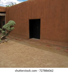 Abiquiu, New Mexico - May 7, 2017: Black Door In Adobe Wall, Georgia O'Keeffe Home And Studio.