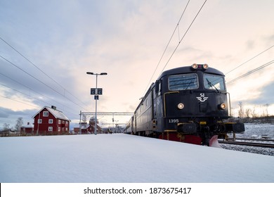 Abisko, Sweden - Dec 03, 2020: Passenger train stop at Abisko Östra railway station in north swedish lapland. SJ passenger trains in northern Sweden