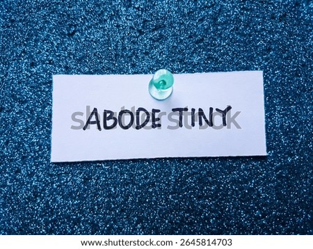 Abode tiny writting on blue background.