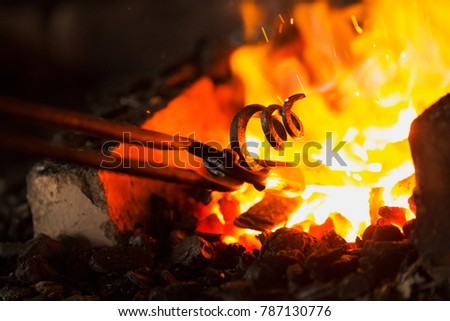 About artistic Forging of Metal. Blacksmithing.
Pattern and forms for the artist blacksmith.
Treatment of molten metal close-up. Handmade blacksmith. Stock photo © 