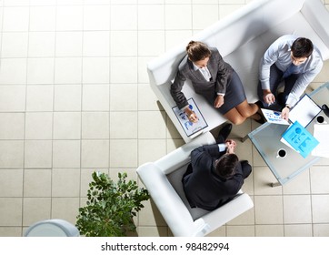 Above Angle Of Three Associates Interacting At Meeting