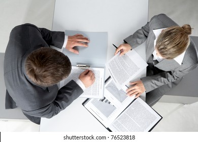 Above Angle Of Two Business Partners Planning Work At Meeting