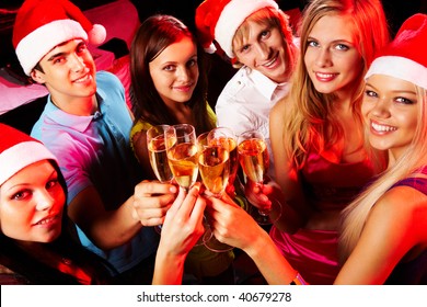 Above Angle Of Young People Enjoying Themselves At Christmas Party