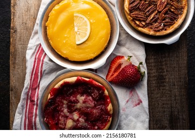 Above Baked Artisan Made Lemon Custard Tart, Pecan Tart, And Strawberry Tart