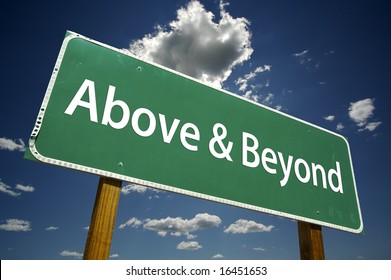 Above And Beyond Road Sign With Dramatic Clouds And Sky.