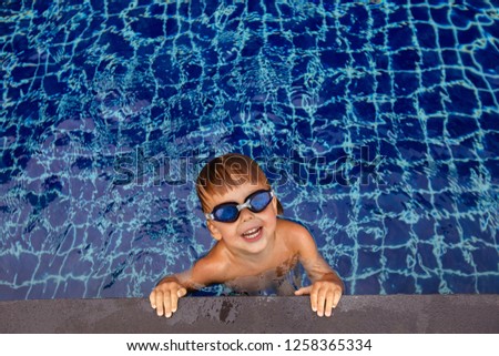 Similar – photo of an adorable boy learning to swim