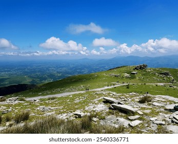 Above the Clouds: A Mountain View Overlooking Valley and Sea