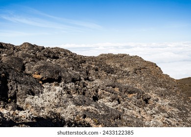 Above the Clouds: Rugged Terrain Meets Endless Sky - Powered by Shutterstock