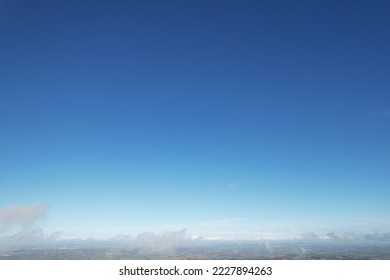 Above the Clouds View. Low Angle View of Dramatical Rain Clouds over Blue Sky During Mid day