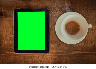 Above, coffee and tablet green screen in cafe for connectivity, research and social media. Display, tech chroma key and espresso on restaurant table for shop review, online banking and communication - Powered by Shutterstock