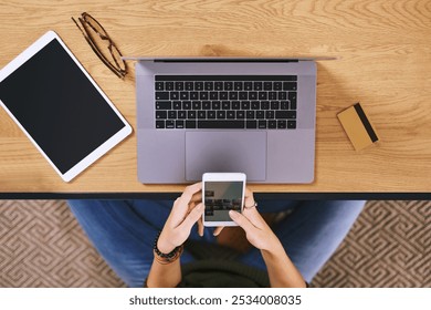 Above, creative and hands with smartphone, screen and selection of pictures, analysis and photo editor. Laptop, display and software for post production, digital and freelancer with tech and person - Powered by Shutterstock