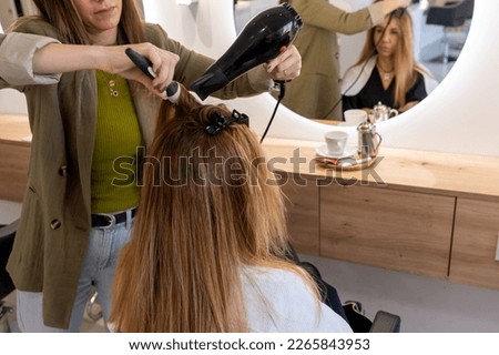 Similar – Image, Stock Photo Cropped unrecognizable female hairstylist using electric trimmer on male client’s hair at salon