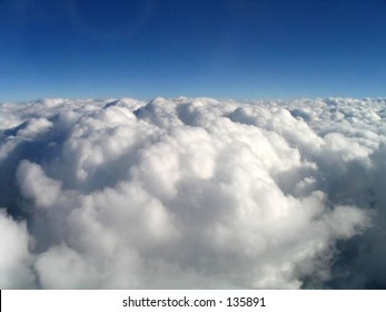 above the earth, above the clouds