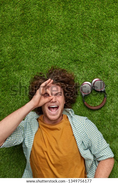 Above Excited Young Guy Curly Hair Stock Photo Edit Now