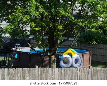 Above Ground Outdoor Swimming Pool In Backyard