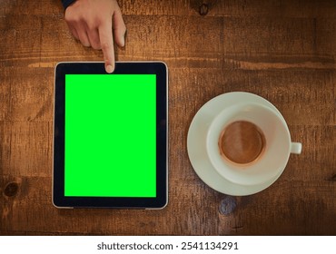 Above, hand and tablet green screen in cafe for connectivity, research and social media at coffee. Person, tech chroma key and espresso on restaurant table for shop review, online banking and contact - Powered by Shutterstock