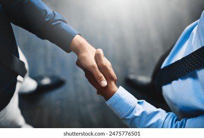 Above, handshake and crm meeting for b2b deal, discussion and business with company contract. Office, people or employees with teamwork or collaboration in workplace for finance or accounting - Powered by Shutterstock