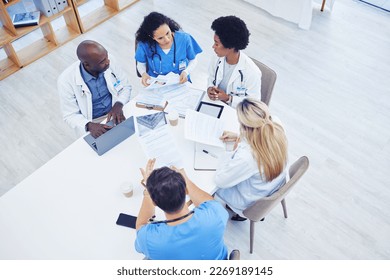 Above, healthcare and meeting by doctors on laptop for research, planning and innovation at hospital. Doctor, team and health experts brainstorm, problem solving or discussing online project together - Shutterstock ID 2269189145
