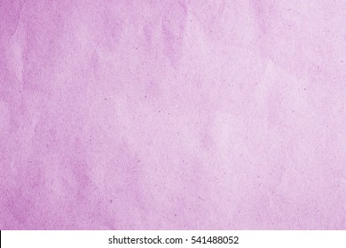 Above Old Scrap Paper Book Kraft Texture In Soft Light Lavender Color On Vertical Table Top View Concept For Card Board Plain Package Background. Parchment Recycle Cardboard Surface Pale Pink Colour.