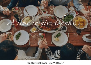 Above, people and praying with overlay by food for thanksgiving, appreciation or religious gratitude. Holiday, feast and family holding hands with text for worship, respect or blessing of celebration - Powered by Shutterstock