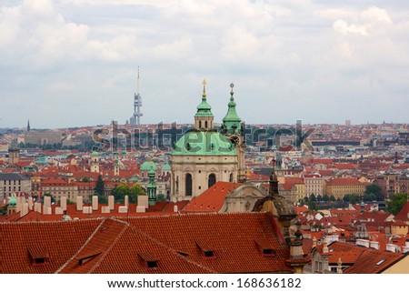 Above the roofs of Prague, old Central European metropolis, modern tourist magnet, and capital of the Czech Republic.