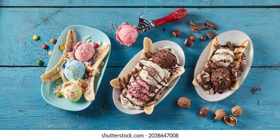 From above of row of plates with fresh banana slices and scoops of ice cream with different flavor served on blue wooden table - Powered by Shutterstock