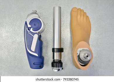 Above View Background Of Disassembled Prosthetic Leg And Foot On Table In Orthopedic Equipment Shop, Disability Concept