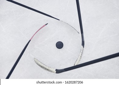 Above View Background Of Hockey Clubs Circling Pluck Ready To Start Match On Skating Rink, Copy Space