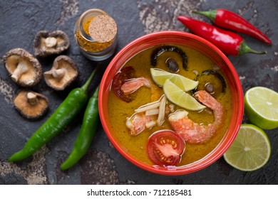 Above View Of A Bowl With Thai Green Curry Soup And Its Cooking Ingredients