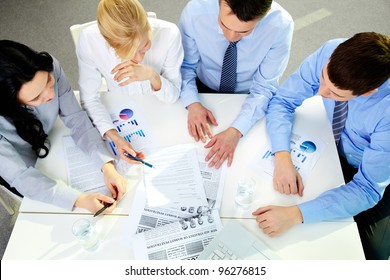 The above view of a business team working with documents