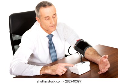 Above View Businessman Measuring Blood Pressure.