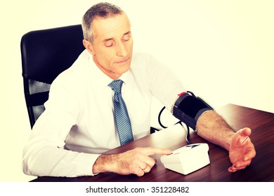 Above View Businessman Measuring Blood Pressure.