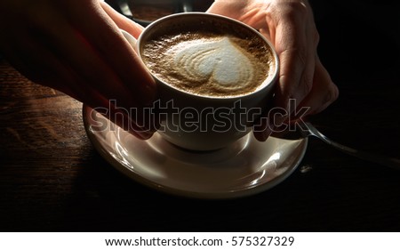 Similar – Hände halten eine Kaffeetasse mit Herzform.