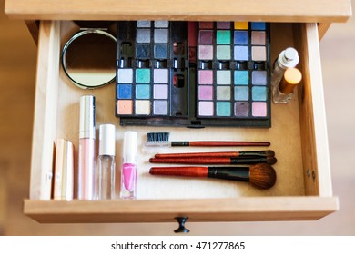 above view of cosmetic set in open drawer of nightstand - Shutterstock ID 471277865