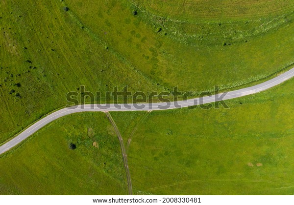 Above view of\
countryside road, aerial drone\
view