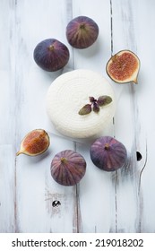 Above View Of Figs With Round Cheese, White Wooden Surface