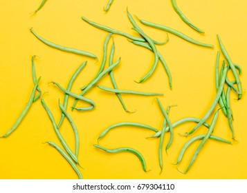 Above View At Green Beans On Yellow Background