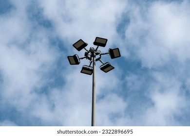 Above view of High-mast lighting, city square or highway lighting pole with blue sky 