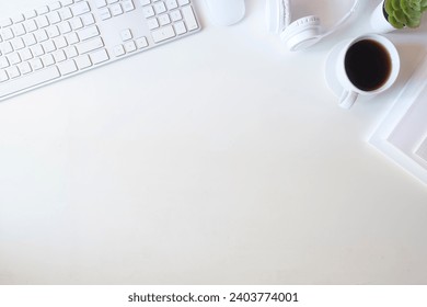 Above view of keyboard, coffee cup, books and glasses on white working desk. - Powered by Shutterstock