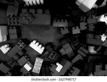 Above View On Black-white Plastic Toy Blocks Background.Black White Toy Bricks With Place For Your Content