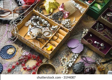 Above View Of Open Jewelry Box Sitting On Top Of Dresser.