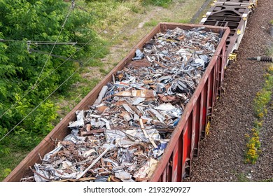 Above view railway cargo train wagon filled by old rusty black metal scrap garbage forfactory plant recycling  Steel waste collecting  disposal transportation logistics  Environmental protection