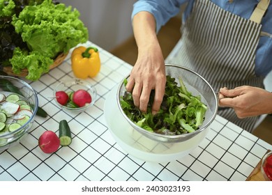 Above view of senior man making a healthy vegetarian meal in the kitchen. Healthy eating concept. - Powered by Shutterstock