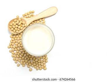 Above view of soy milk with soybean on the spoon isolated on white background. Have a copy space ready for your text.